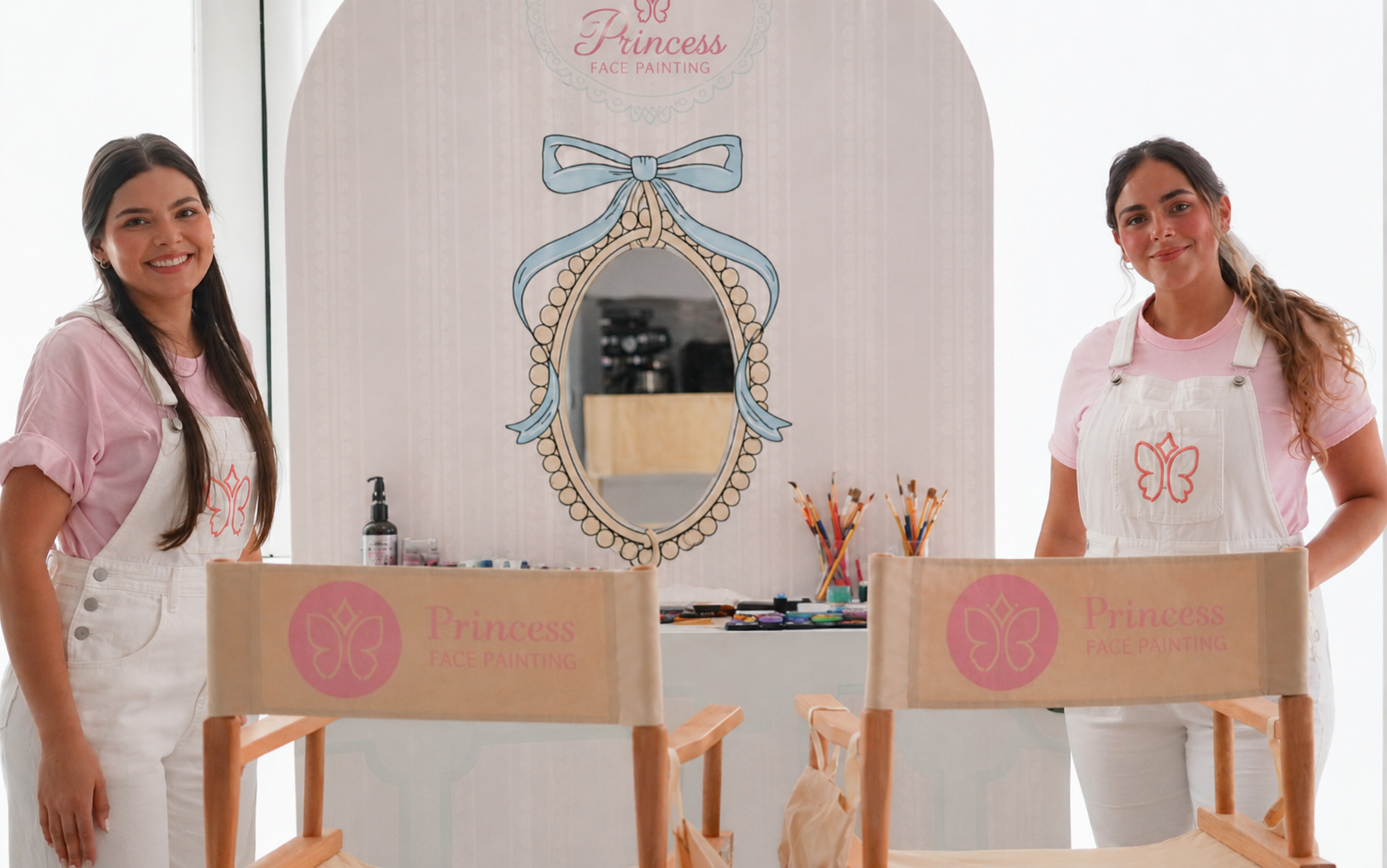 Hair and makeup station with two artists and branded chairs