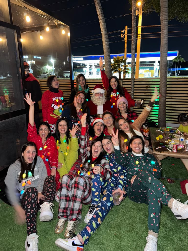 Christmas pajama party group photo with Santa