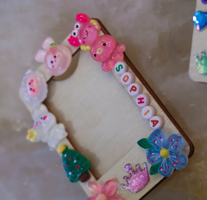 Polaroid keepsake frame with name beads, flowers and charms