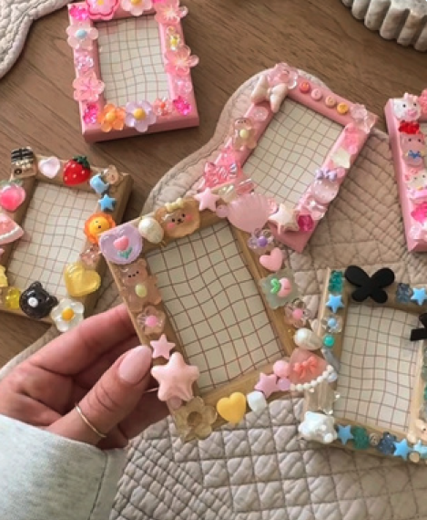 Pastel photo frames covered in charms, stars and flowers