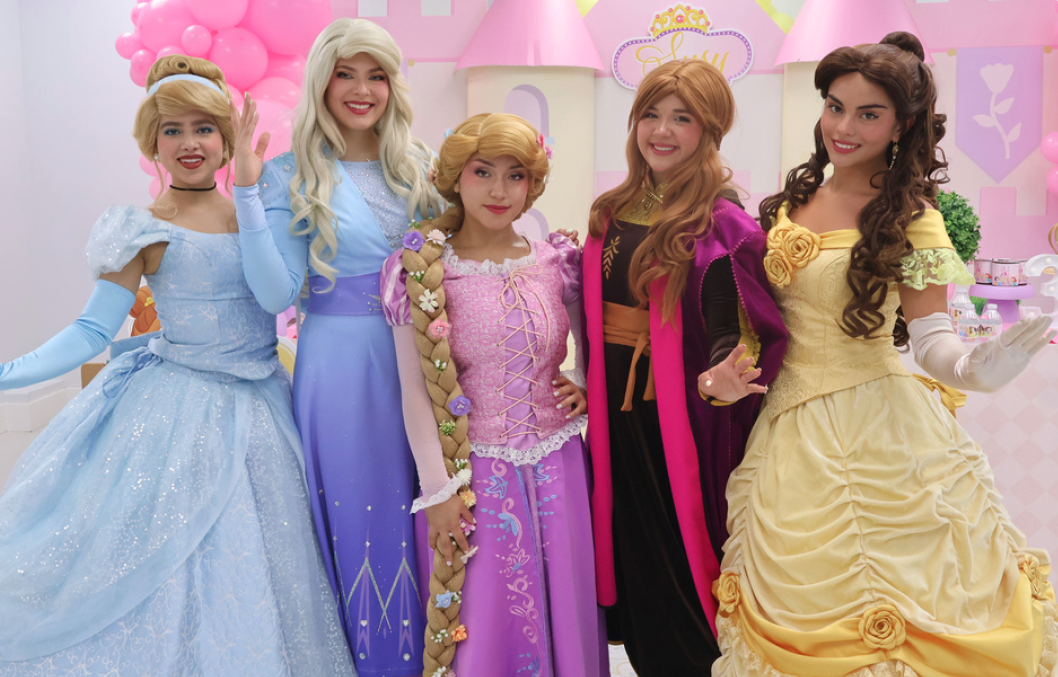 Princess characters posing in front of a castle backdrop