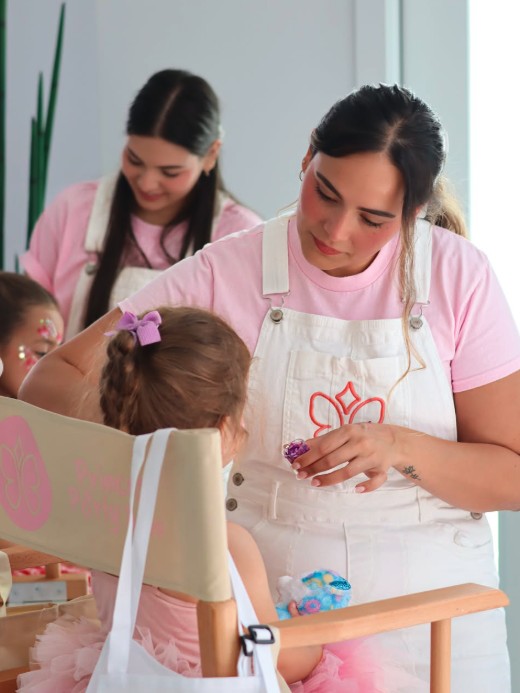 Creative Corner artists styling kids hair with glitter