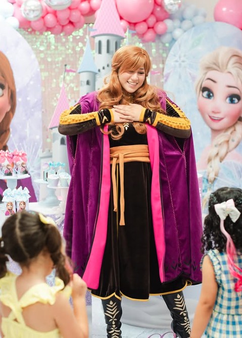 Princess character greeting kids at a winter themed party