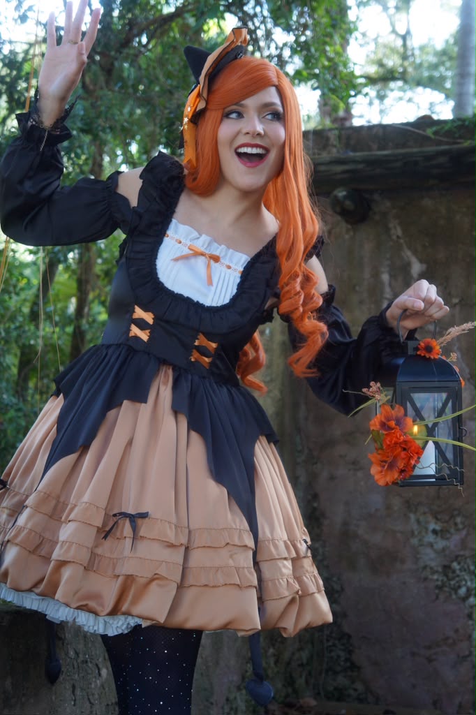 Halloween witch character waving with her lantern